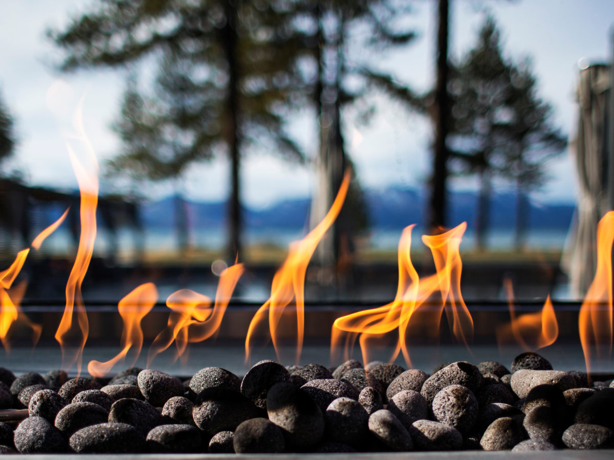 Custom fire pit with rounded pebbles
