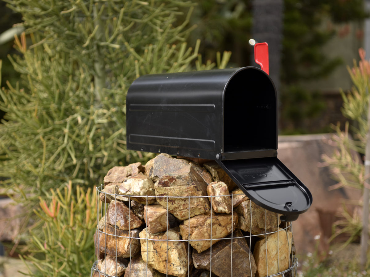 Gabion basket mailbox with crushed rock