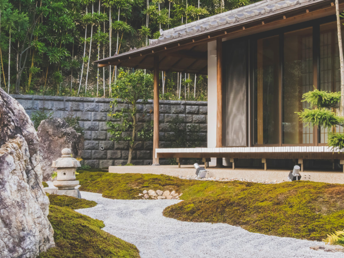 Zen garden with raked sand and moss
