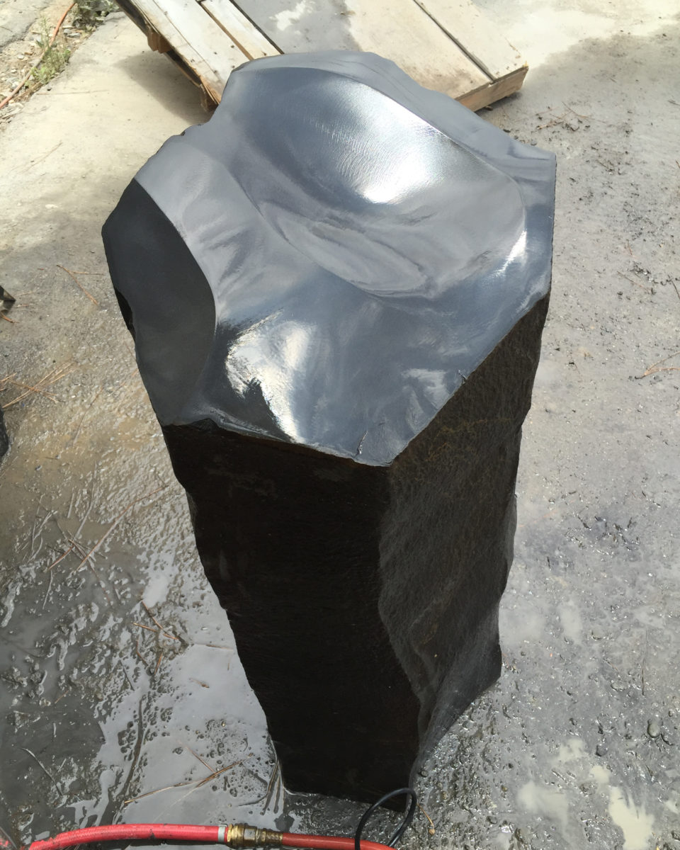 Polished black custom stone piece
